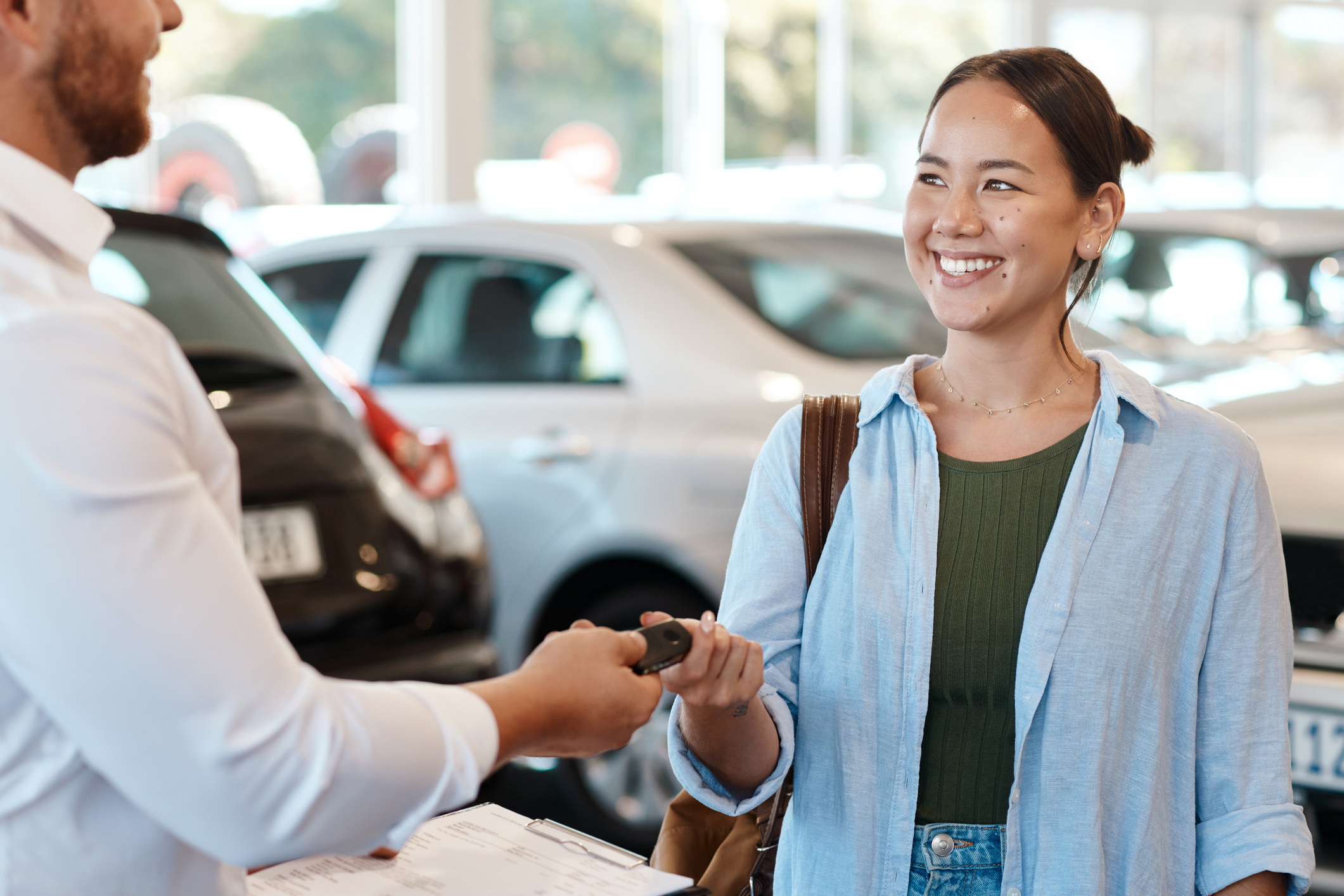 Woman getting the keys for her new car